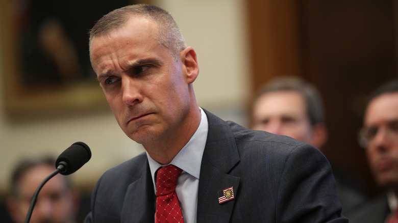 Corey Lewandowski behind a microphone