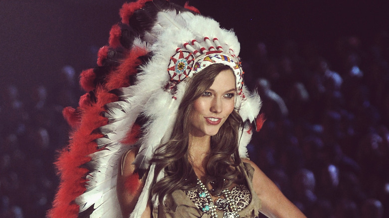 Karlie Kloss in a Native American headdress