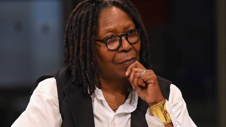 Whoopi Goldberg with hand on chin 