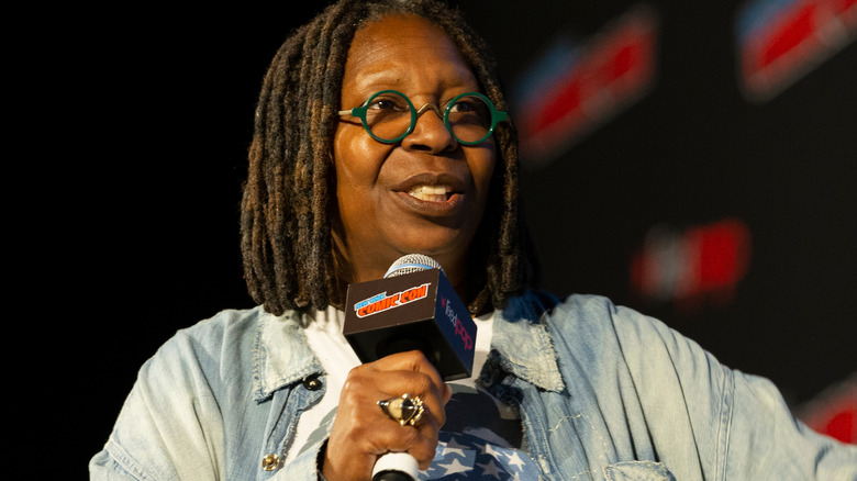 Whoopi Goldberg speaking at an event 