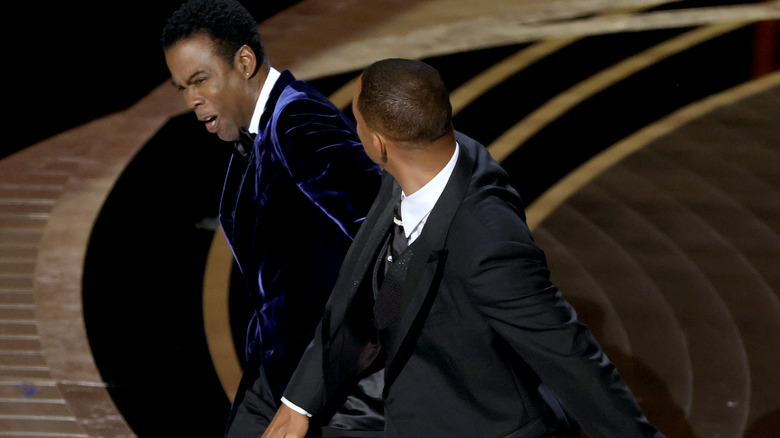 Chris Rock grimacing after Will Smith slap