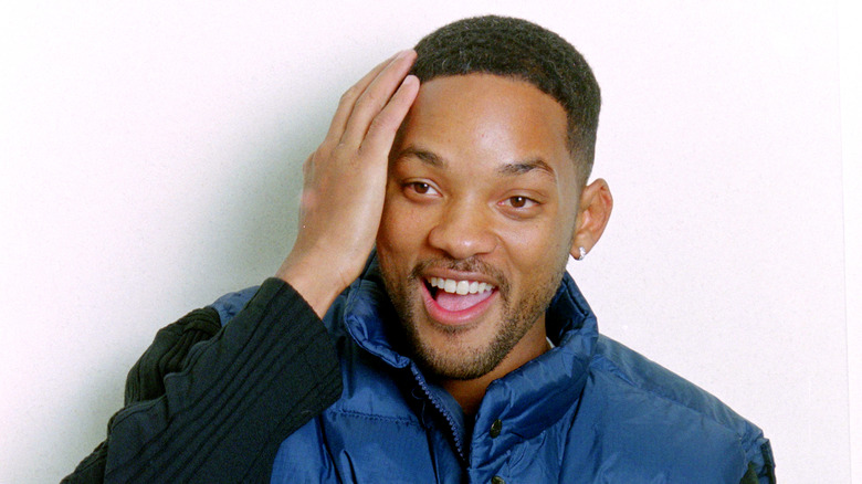 Will Smith with hand on face