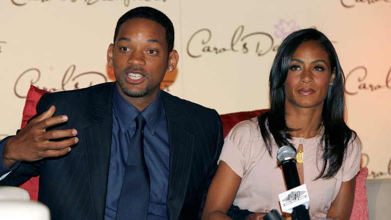 Will Smith speaking beside Jada Pinkett Smith