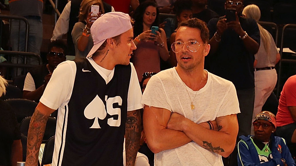 Justin Bieber and Carl Lentz courtside 