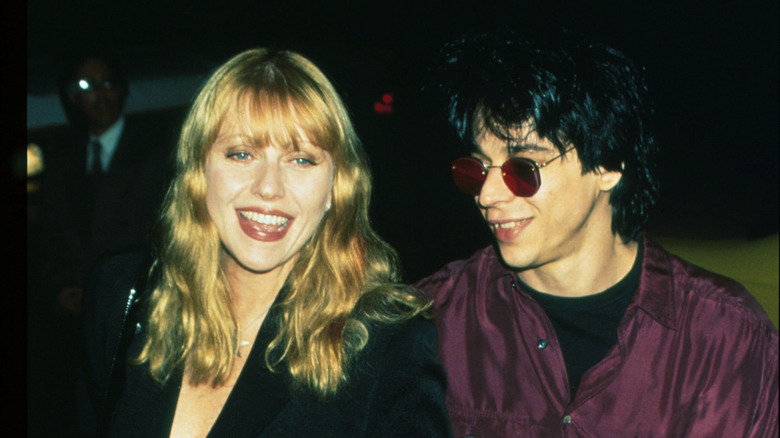 Bebe Buell and Coyote Shivers walk hand-in-hand in 1996