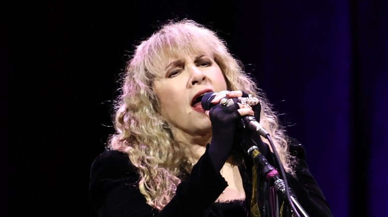 Stevie Nicks singing into microphone