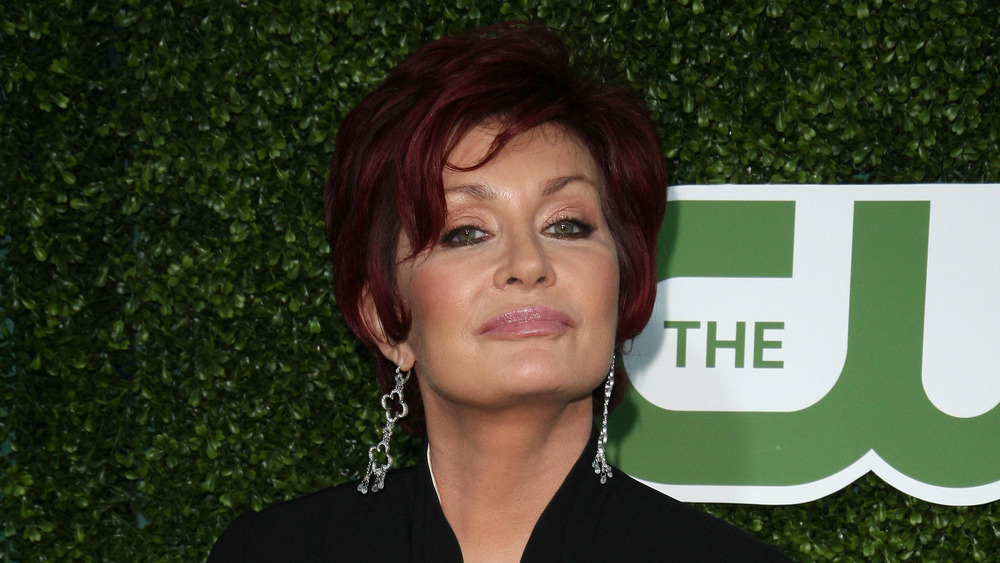 Sharon Osbourne smirking