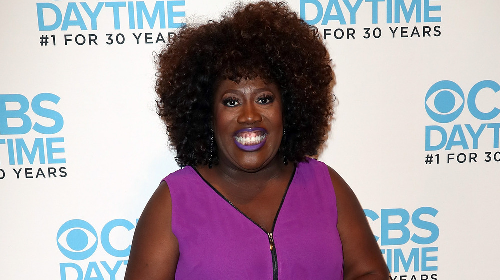 Sheryl Underwood with purple lipstick