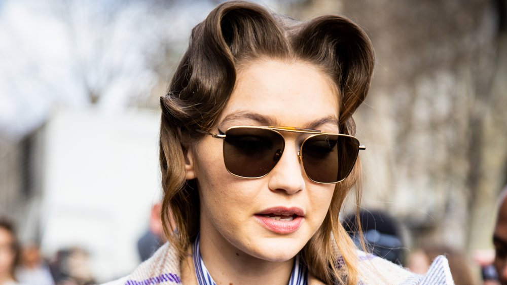 Gigi Hadid with curled hair and sunglasses