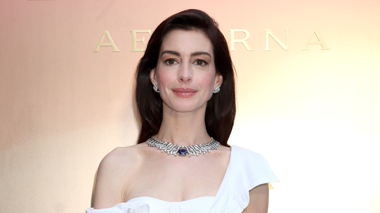 Anne Hathaway wearing a white dress