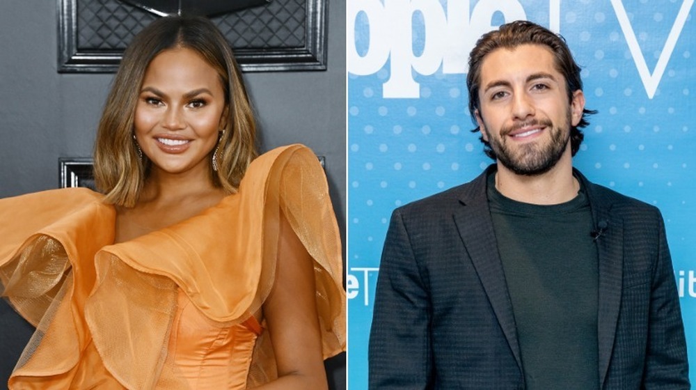 Chrissy Teigen and Jason Tartick smile