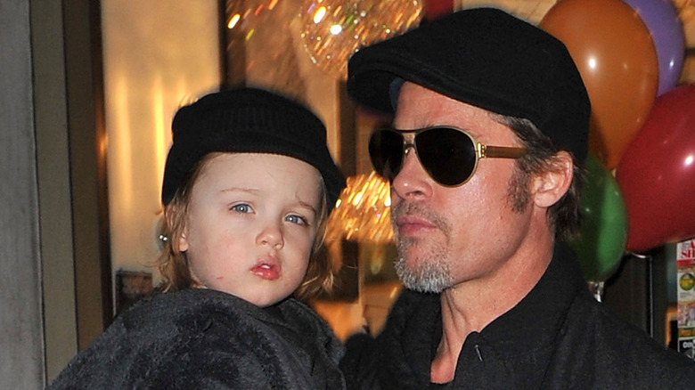 Brad Pitt holds young Vivienne