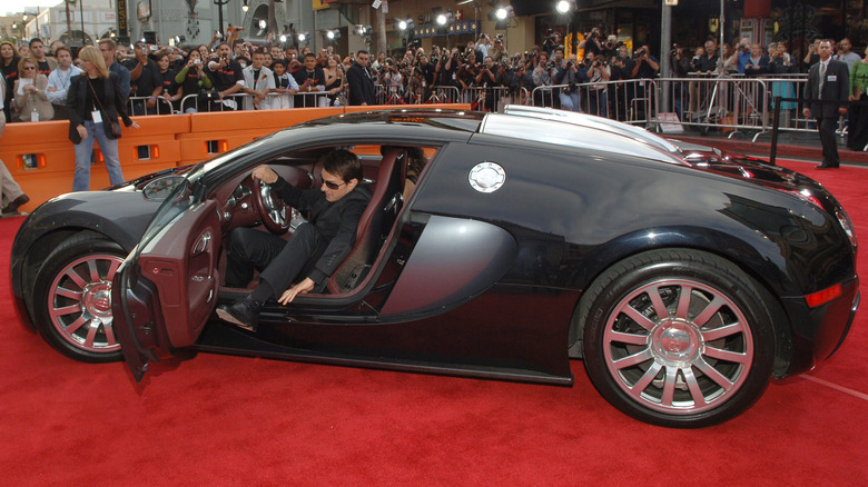 Tom Cruise getting out Bugatti