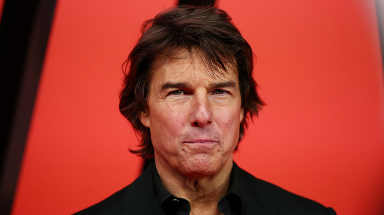 Tom Cruise puckered lips frowning