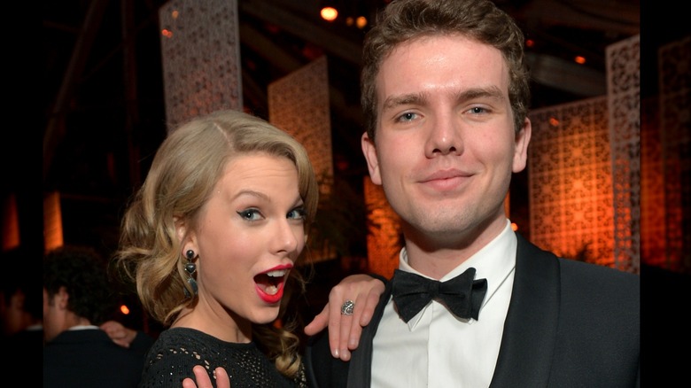 Taylor and Austin swift smiling at event