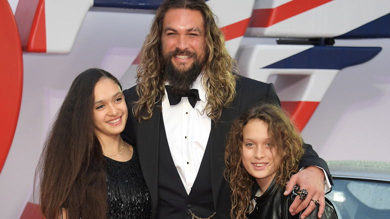 Jason Momoa posing with his children