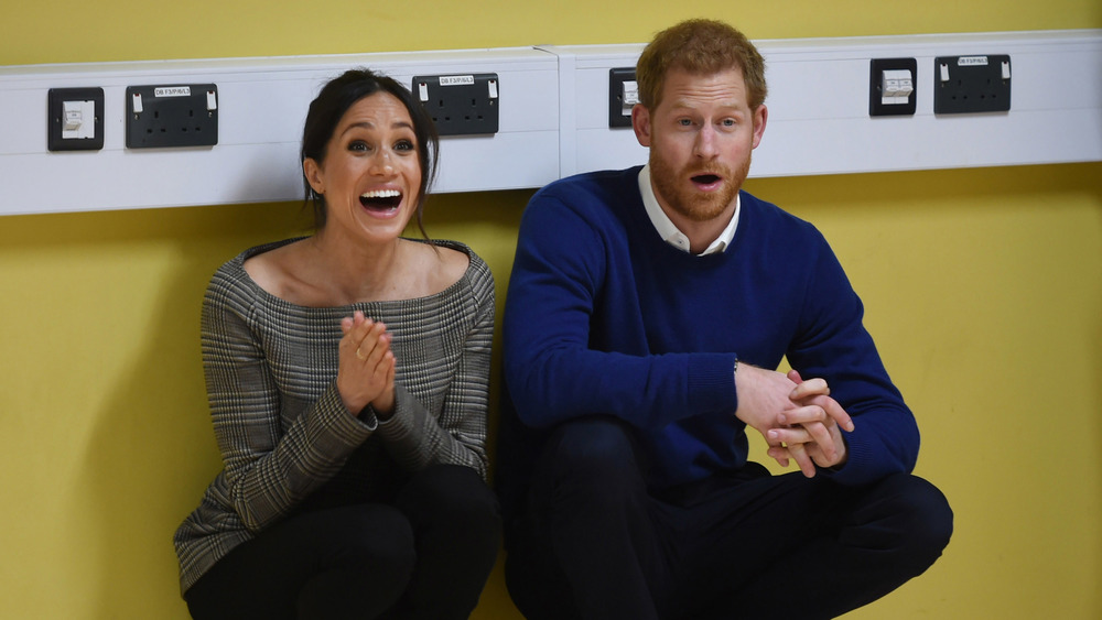 Prince Harry and Meghan Markle laughing