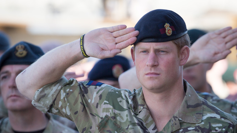 Prince Harry saluting in uniform