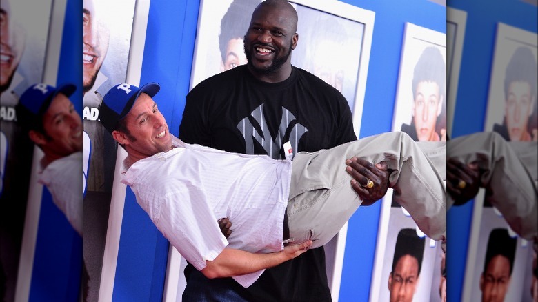 Shaquille O'Neal holding Adam Sandler