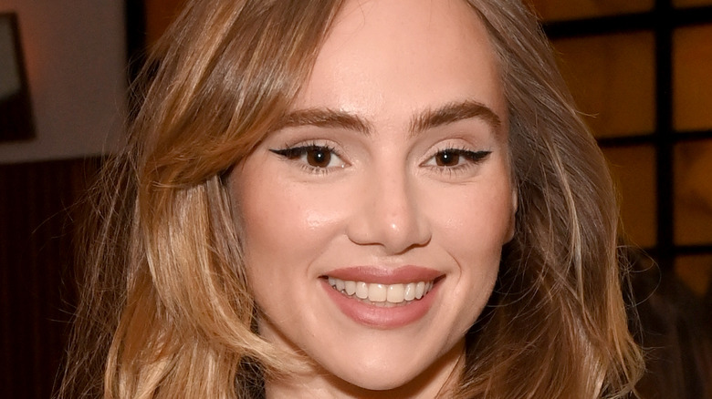 Suki Waterhouse smiling