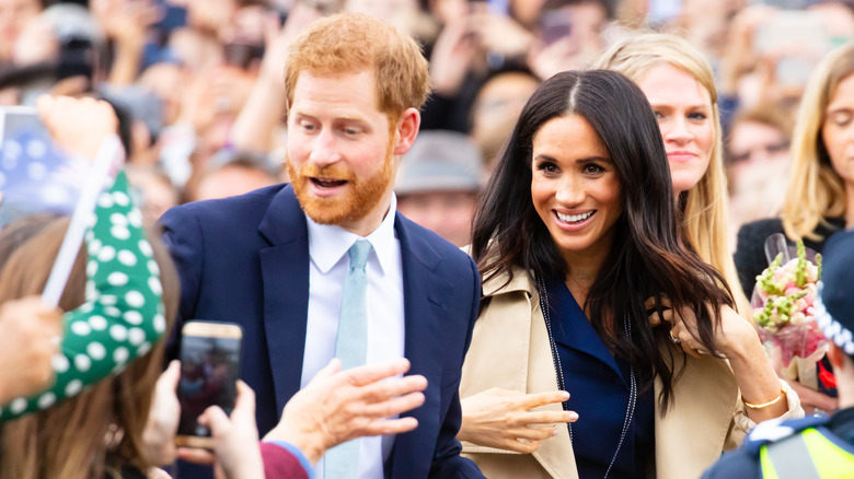 Prince Harry and Meghan Markle in a crowd