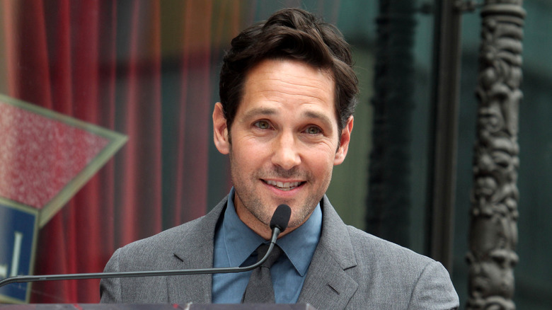 Paul Rudd speaking into a microphone