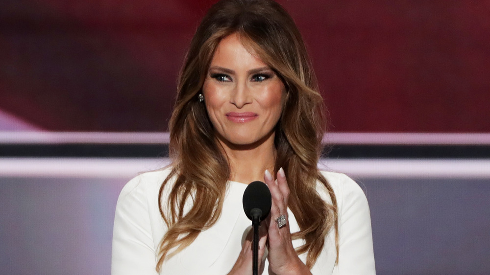 Melania Trump on stage, clapping