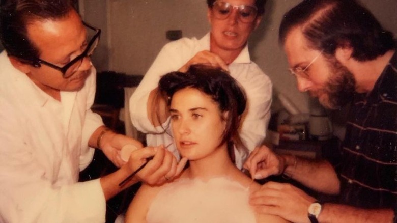 Demi Moore having prosthetics applied on set 