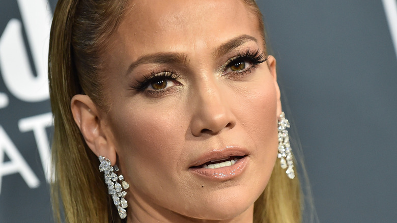 Jennifer Lopez poses in drop earrings