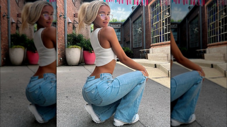 Olivia Dunne posing in jeans