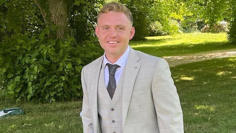 Jack Luby wearing a suit