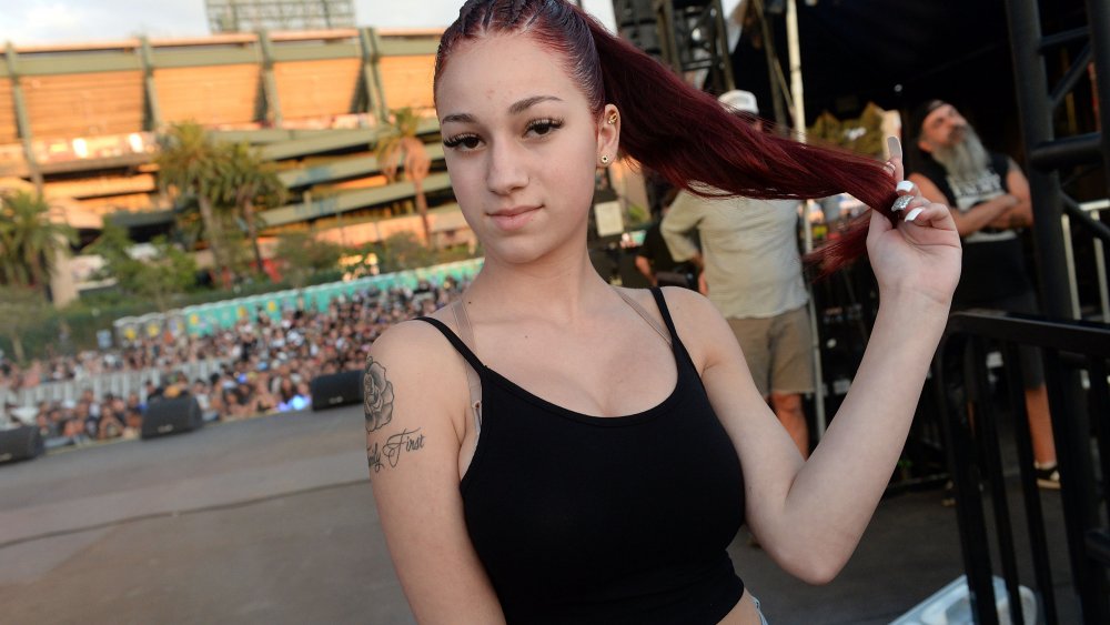 Danielle Bregoli twirling her red ponytail 