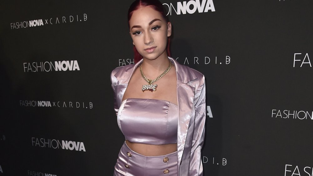 Danielle Bregoli in front of Fashion Nova wall