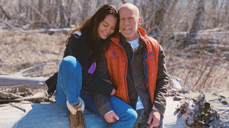 Emma hugs Bruce Willis in photo outdoors