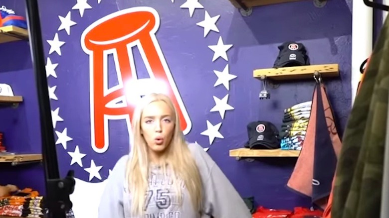 Alex Cooper with Barstool Sports logo