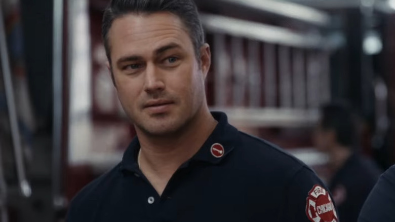 Taylor Kinney as Kelly Severide, looking on