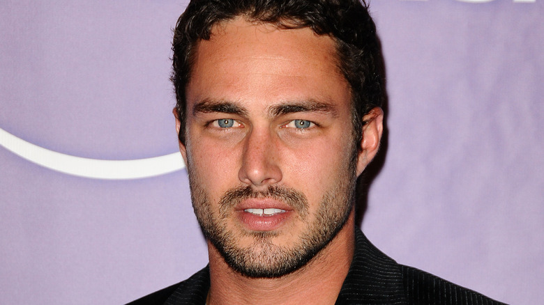 Taylor Kinney staring into camera