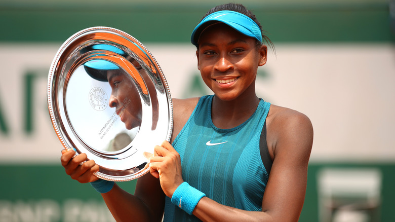 Coco Gauff holding award