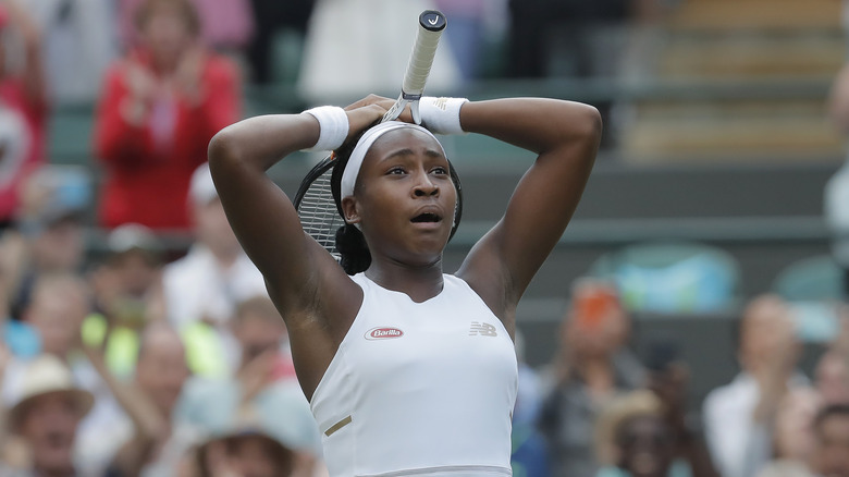 Stunned Coco Gauff holding her hands on her head