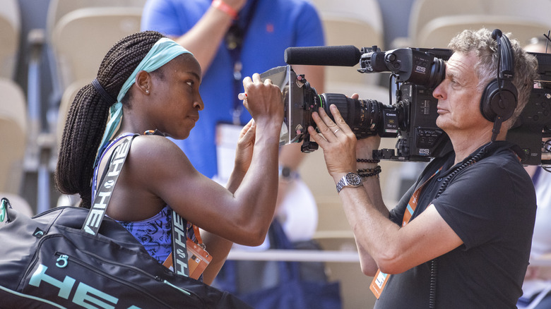 Coco Gauff writing on camera