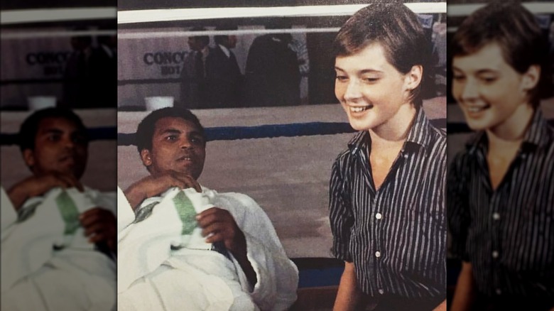 Isabella Rossellini smiles next to Muhammad Ali