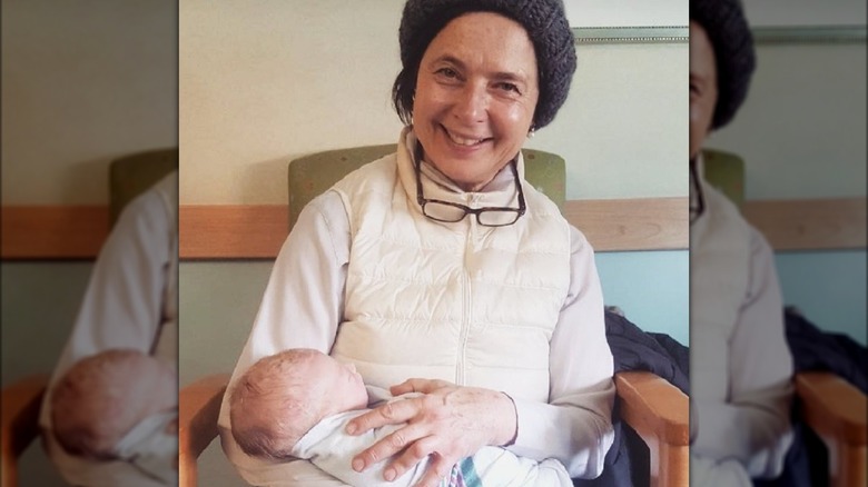 Isabella Rossellini holds her grandson Ronin Lane