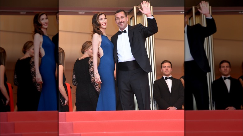 Jackie and Adam Sandler posing together at top of Cannes stairs
