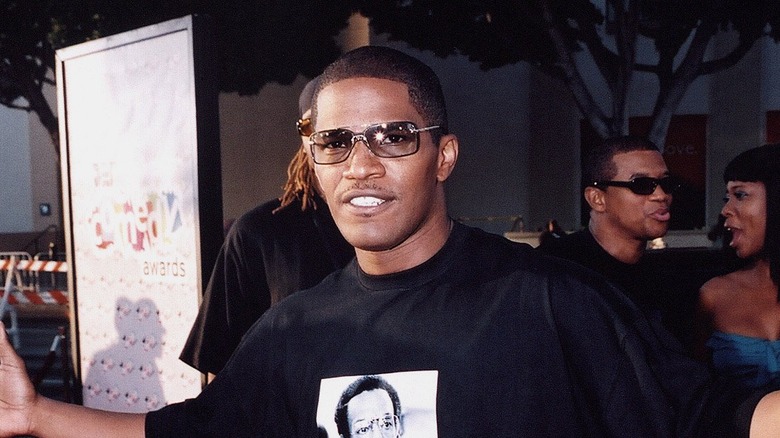 Jamie Foxx posing in black T-shirt and sunglasses