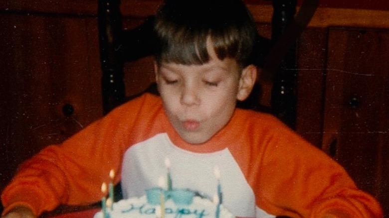 Young Jimmy Fallon blowing out birthday candles