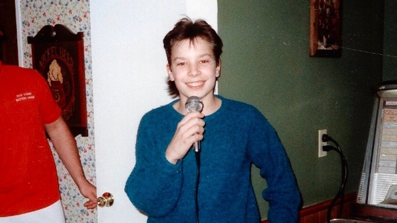 Teenage Jimmy Fallon with a microphone