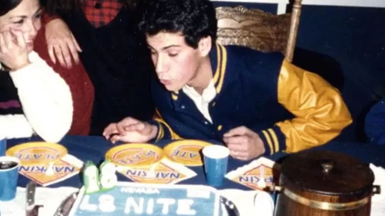 Jimmy Kimmel blowing out candles on a cake