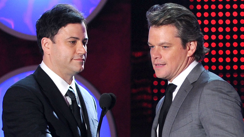 Matt Damon and Jimmy Kimmel speaking on stage (2011)