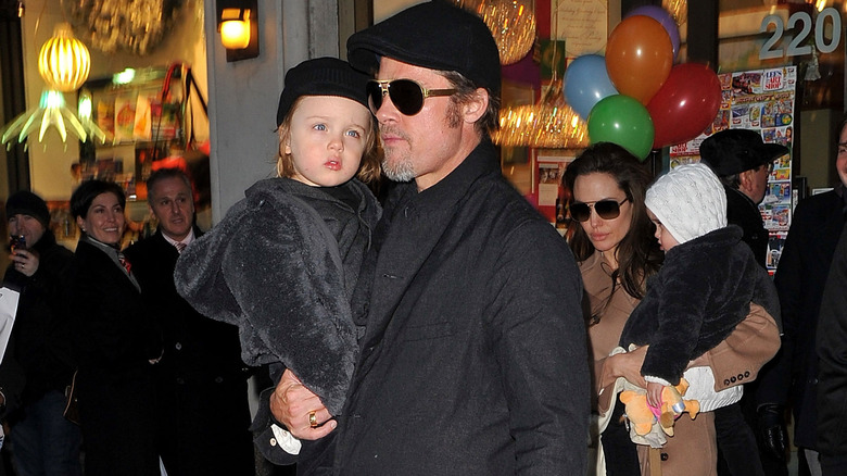 Brad Pitt holding Knox Jolie-Pitt