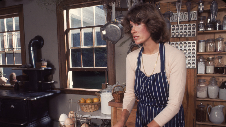 Martha Stewart cooking in her kitchen in 1976